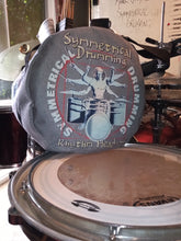 Load image into Gallery viewer, Symmetrical Drumming V3 - Duffel Bag (Grey) - Large kit bag sitting on drums holding drumsticks and sheet music - end view - Keen Eye Design